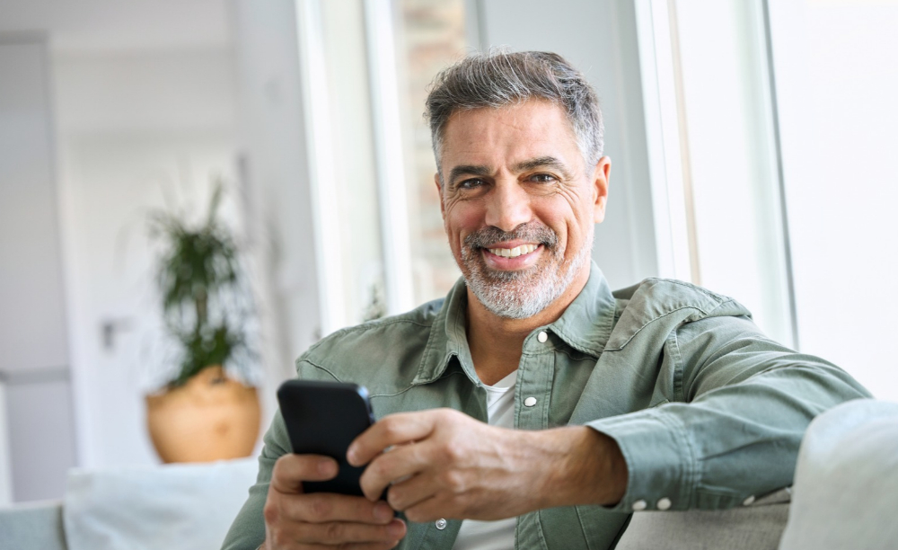 Middle aged man smiling at the camera